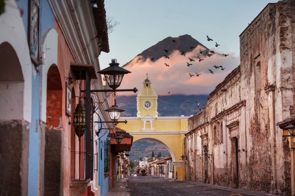 The yellow arch and colourful streets of Antigua, Guatemala.