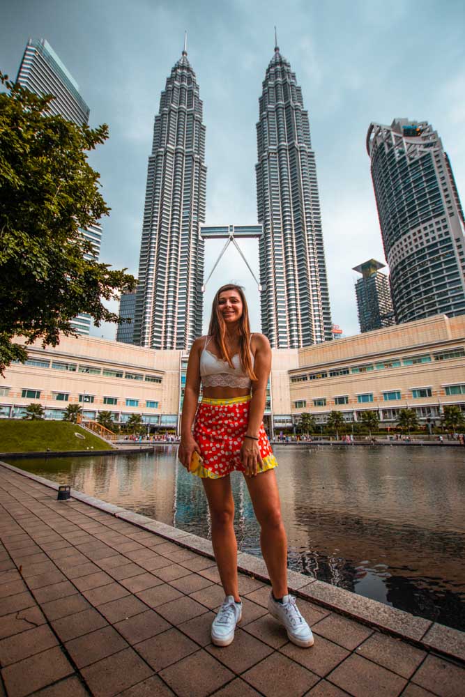 Melissa stands in front of the Petronas Twin Towers in Kuala Lumpur.