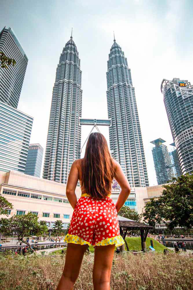 Melissa looks up at the Petronas Twin Towers from the KLCC park.