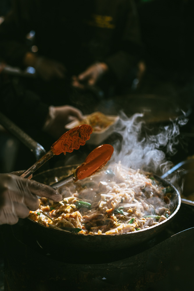 street food sizzling in a wok.