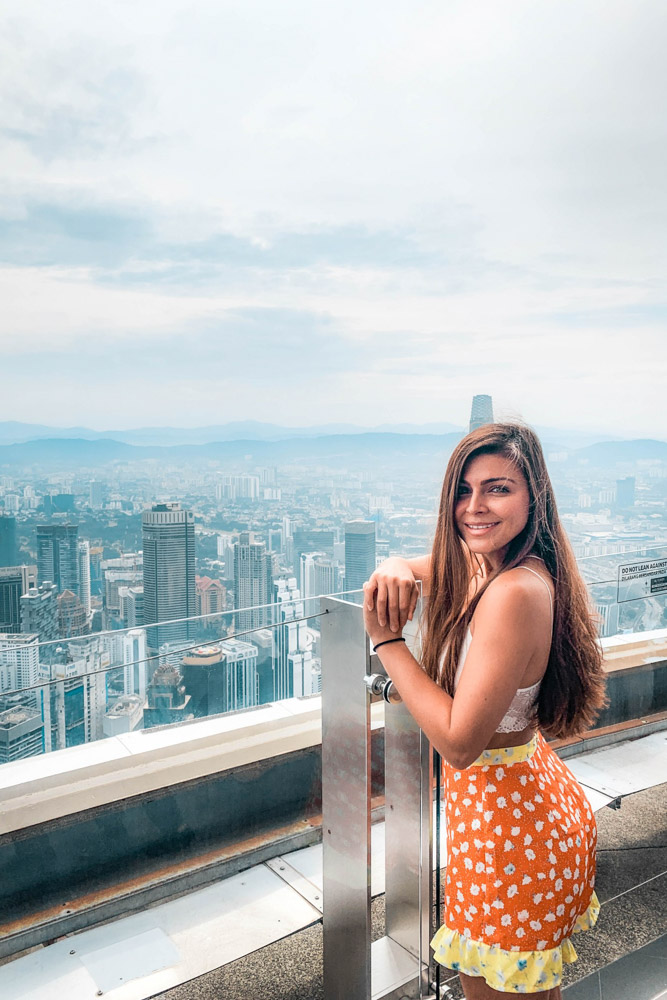 Melissa looks out over the city of Kuala Lumpur from the Sky Deck at the Menara Tower.