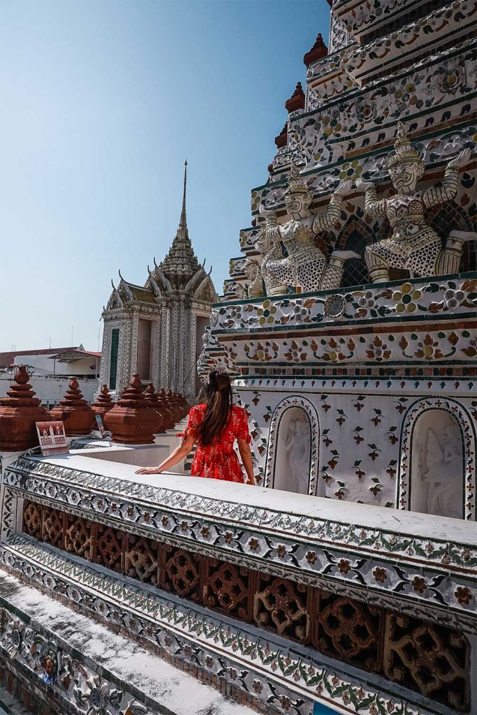 Melissa facing the opposite way on one of the sides of Wat Arun