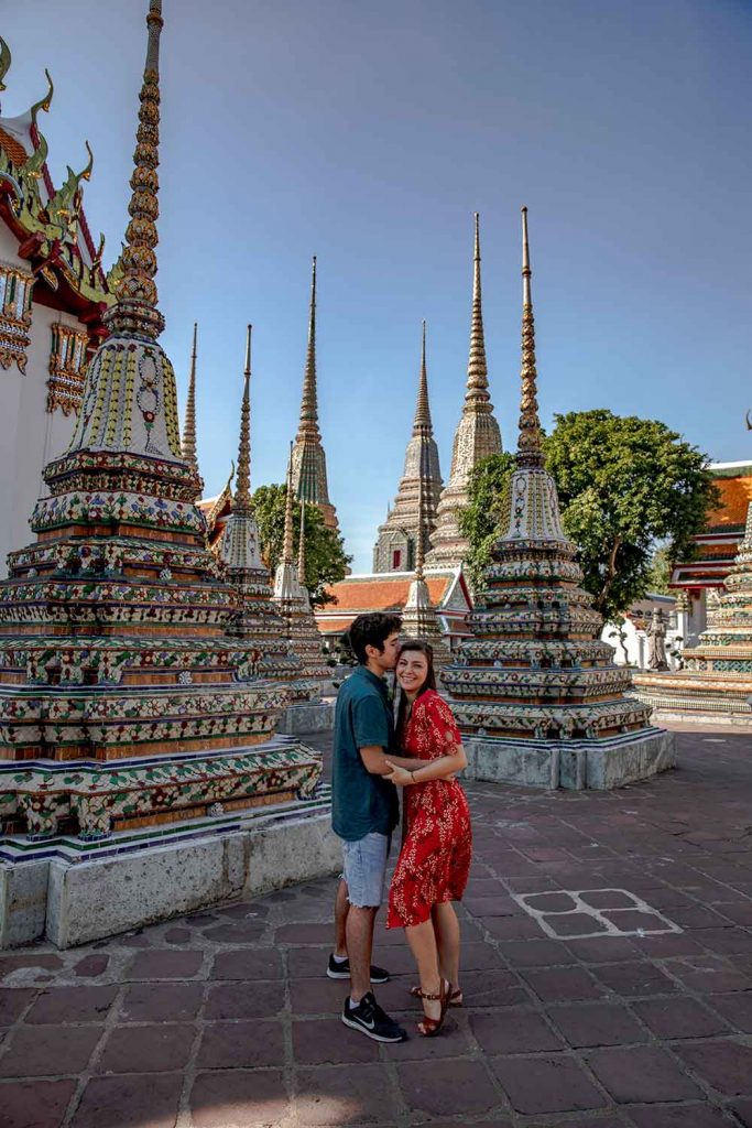 Melissa and Guga hugging with colourful spires in the background