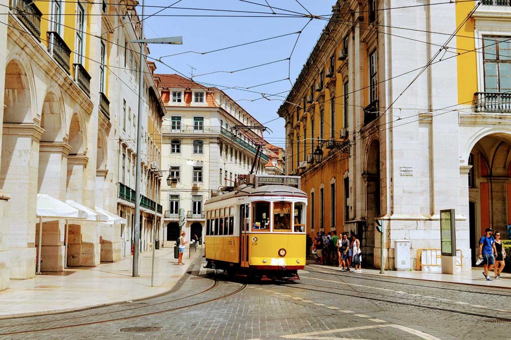 28 tram rattles down the cobbled streets of lisbon portugal