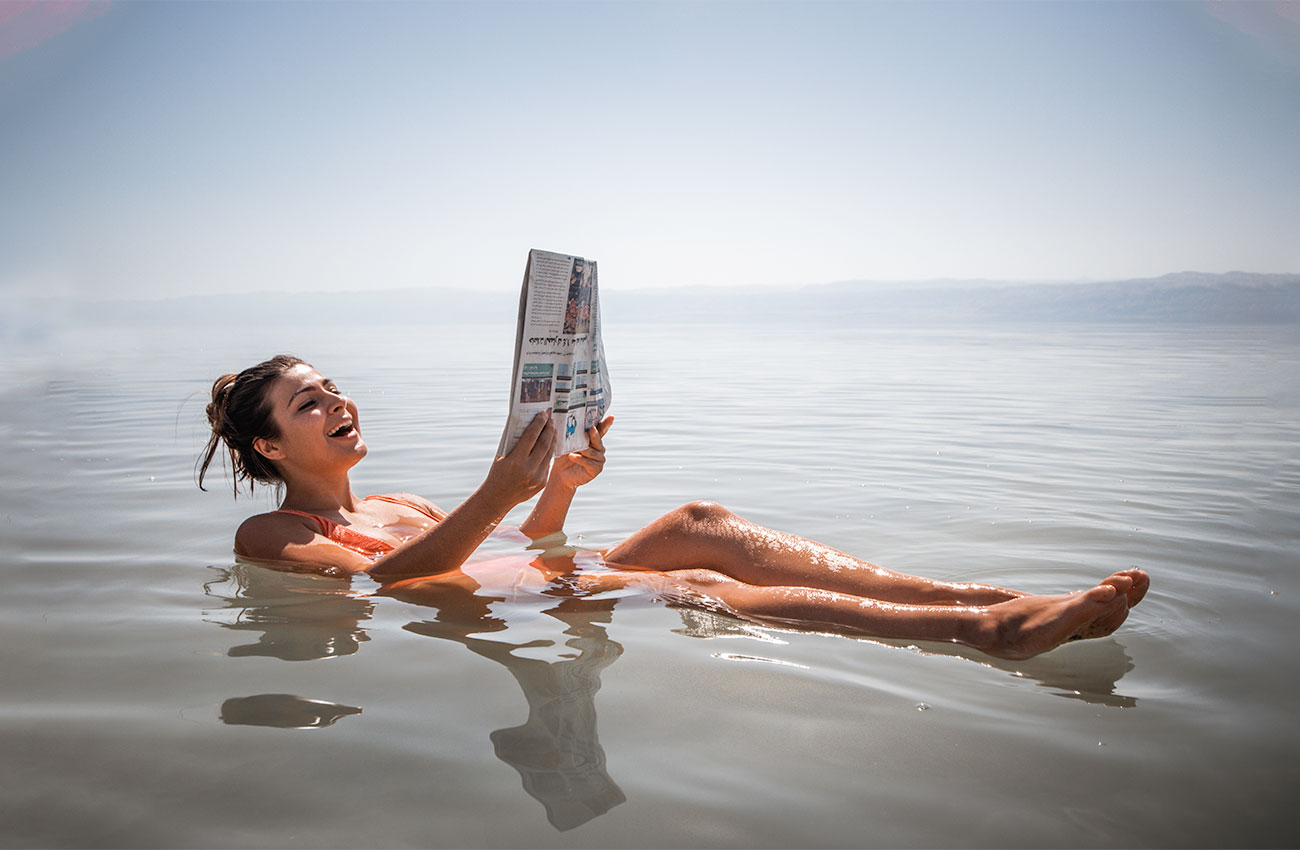 Melissa floating on the Dead Sea, one of the highlights of doing a Dead Sea trip