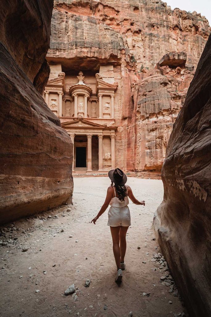 Melissa standing on the Al Siq in Petra Jordan with the Treasury in the background