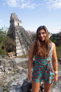 Melissa standing in front of Tikal Ruins in Guatemala