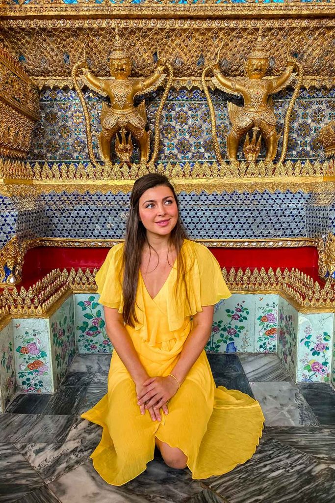 Melissa sitting at a prayer site inside the grand palace