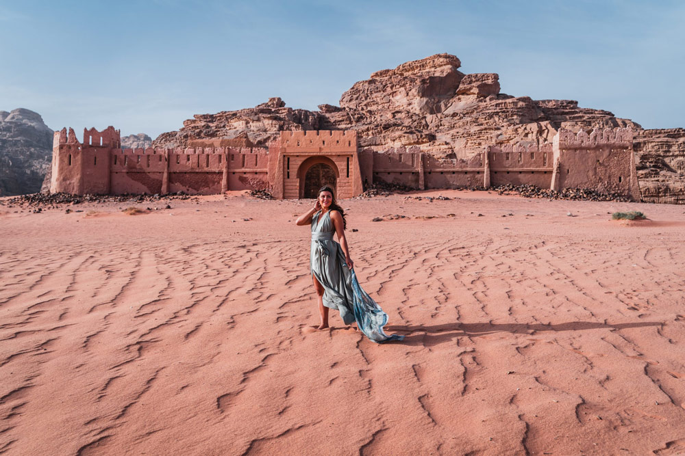 Melissa stands in front of the French Fortress in the Wadi Rum desert,