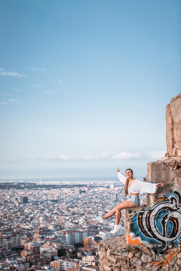 Melissa sitting at the edge on the Bunker El Carmel in Barcelona