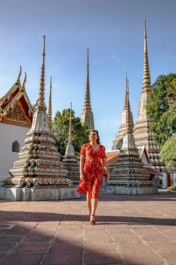 Melissa walking around Wat Pho Temple in Bangkok Thailand