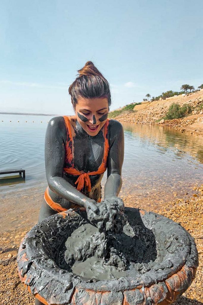 Melissa covered in the dead sea mud in jordan