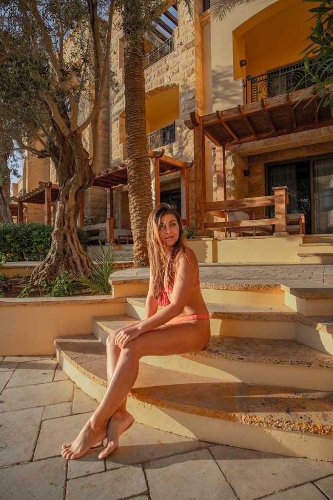 Melissa sitting on the stairs outside Kempinski Hotel Ishtar Dead Sea