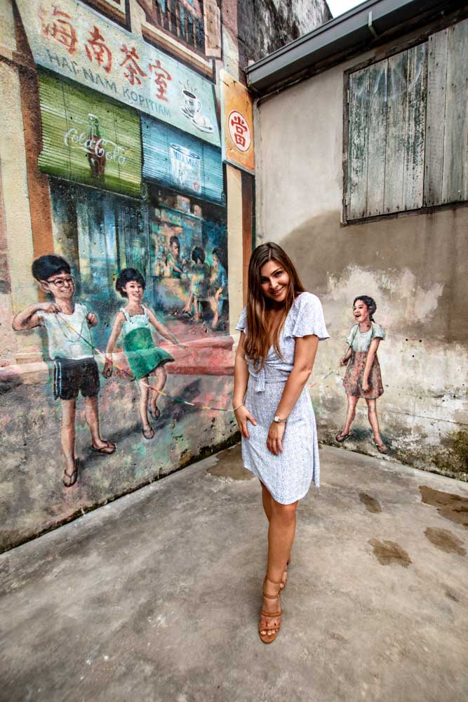 Melissa stands in the cool graffiti streets of Chinatown in KL.